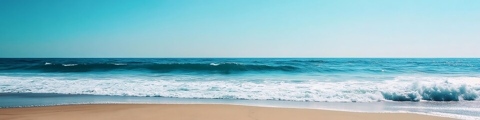Obraz premium A serene beach with soft waves and a clear sky, perfect for text