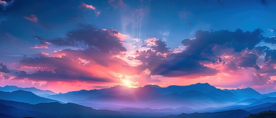 Vibrant Sunset Over Mountain Silhouette