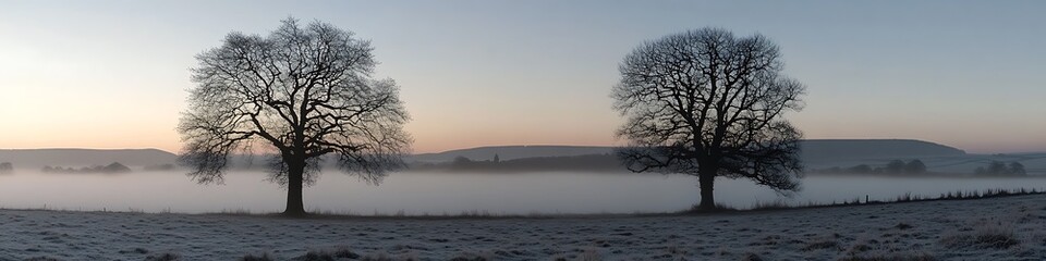 A serene, misty morning in the countryside with a clear sky and space for text