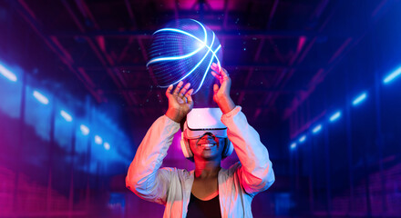 Basketball player holding basketball hologram at futuristic sport arena. Energetic athlete or sport person practicing basketball skill by using augmented reality technology. Innovation. Ingenuity..