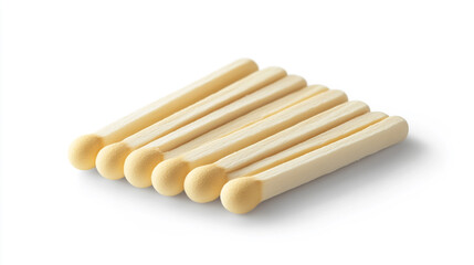 Simple white safety matches arranged in a neat line on a light background