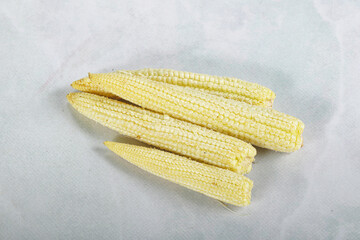 Raw sweet baby corn heap