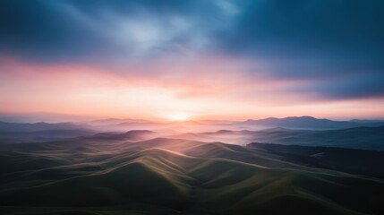 A dramatic sunrise paints the sky in vivid hues over rolling misty hills, creating a breathtaking scenic view that evokes tranquility and wonder.