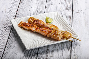 Grilled salmon skewer with sauce