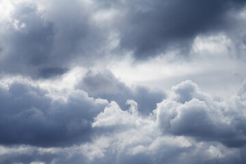  Light breaks through gray clouds in the sky, light inside the cloud.