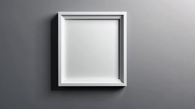 A white frame hangs on a gray wall