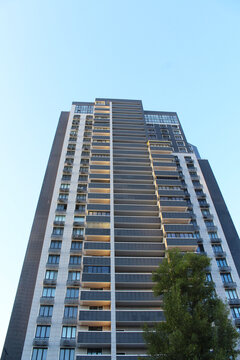 the facade of the new building against the blue sky