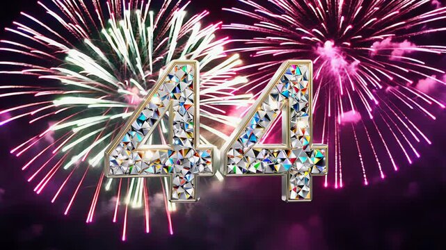 Dazzling crystal diamond number forty four 44 shines brightly against a contrasting dark backdrop. Fireworks in the background. For congratulations and anniversaries