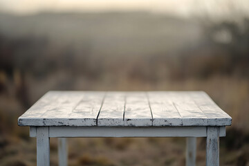 Fototapeta premium Rustic white wooden table with a blurred nature scene in the background creating a peaceful outdoor atmosphere 