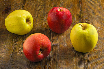 Fresh Red and Yellow Apples on Wooden Background