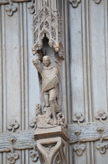 Intricate Wooden Sculpture of a Knight on a Gothic Door in Brussels
