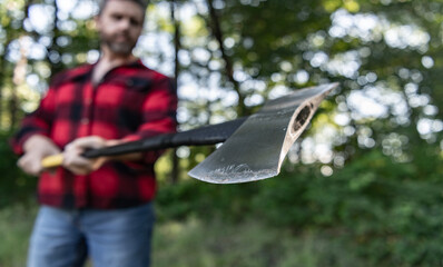 Cutting wood. Sharp blade. Brutality and masculinity. Lumberjack with axe in selective focus. Brutal lumberjack. Lumberjack style. Man with axe blade. Axe in man hand chopping wood