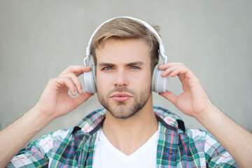 Modern lifestyle. Student life. Listen to music in headphones. Man millennial generation listen audio. Music lover lifestyle. Soothing tunes. Millennial man listen music outdoor. Getting inspiration