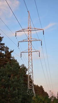 Power line support against blue sky, Power line support against forest