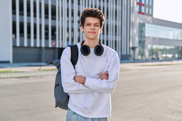Portrait of college student guy looking at camera outdoor, urban style © Valerii Honcharuk