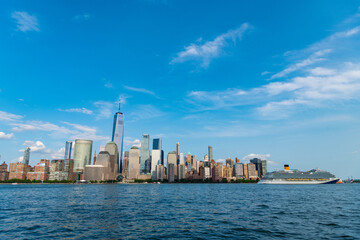 Fototapeta premium Cruise ship York. Skyline of New York Manhattan cruising on the Hudson River cruise liner. New york cruise lines ships vacation