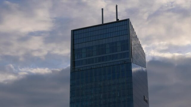 Gdansk, Olivia Star drone shot of modern office buildings and construction crane at sunset