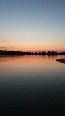 Fototapeta premium Sunset over the lake, twilight over the lake