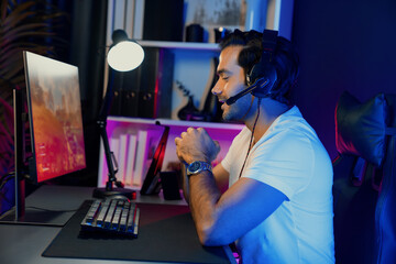 Smart gaming streamer enjoy playing battle team with streaming online shooting gun game with multi...