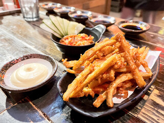 Deep fried potato stick with mayonnaise dipping at Japanese restaurant.