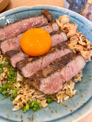 Wagyu Donburi with pickled eggs yolk recipe features high-quality beef cooked and served over fluffy Japanese rice with yakiniku sauce and green onions.