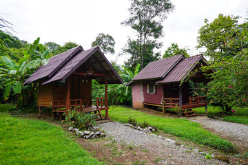 Wooden knockdown house. Local accommodation view, Touristic resort on tropical forest background at Phu pha man National Park, Khon kaen, Thailand.