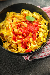 Pasta tagliatelle tomato sauce second course tasty food dish fresh delicious gourmet food background on the table rustic food top view copy space