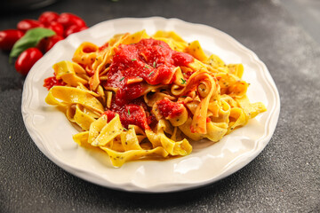 Pasta tagliatelle tomato sauce second course tasty food dish fresh delicious gourmet food background on the table rustic food top view copy space