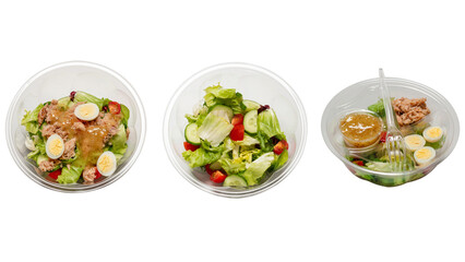 Fresh tuna salad with lettuce, cucombers, cherries and eggs in plastic container.
