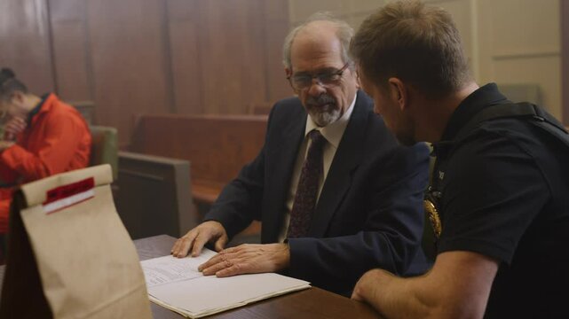 Cop lawyer and inmate in court room