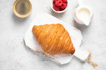 freshly baked golden French croissant