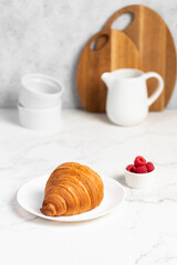 freshly baked golden French croissant