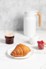 freshly baked golden French croissant