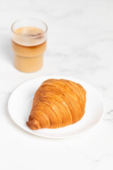 freshly baked golden French croissant