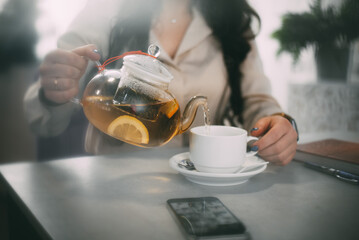 Woman Resting by Dumbbells in Gym