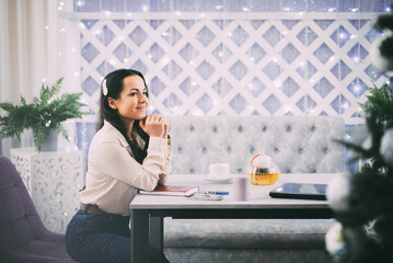 Thoughtful Woman in a Relaxing Cafe
