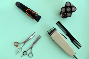 hairdressing tools for haircuts, machine, comb, scissors, trimer and shaver on a blue background