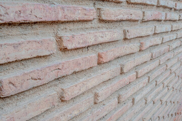 weathered classic red brick wall from unusual perspective