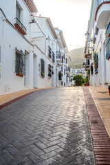 Obraz premium benalmadena old village architecture details during dusk hour, street view
