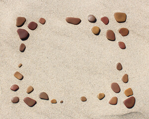 frame of natural rocks on sand, organic frame background