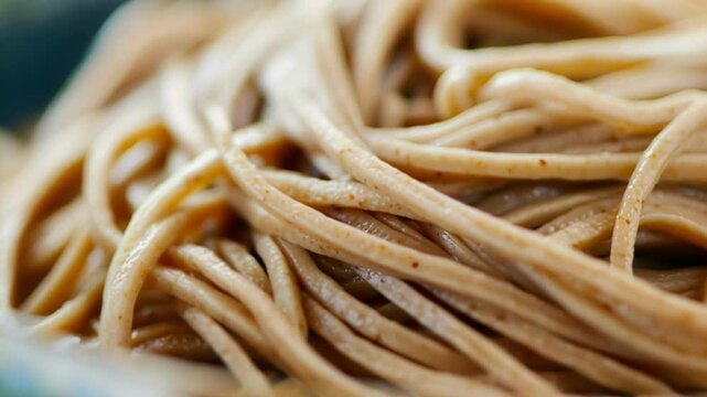 Hot, steaming soba noodles in a bowl, a healthy and tasty lunch option. Traditional japanese dish made from buckwheat, perfect for a nutritious meal