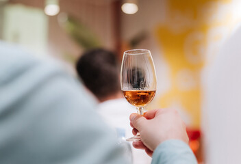 Elegant whiskey tasting experience, showcasing premium golden whiskey in a glass, refined events