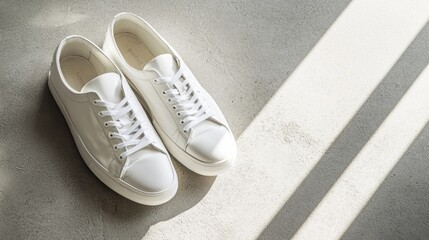 A pair of white sneakers on a clean concrete floor natural light   perfect for lifestyle blog posts and fashion e-commerce.