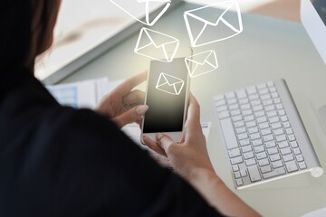 Woman hand using a smartphone with mail illustrations