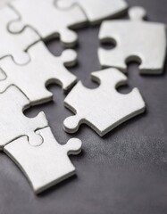 Obraz premium close-up of connected puzzle pieces, illustrating the concept of teamwork.