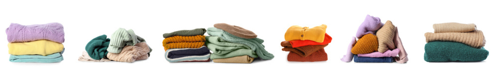 Set of stacked warm clothes on white background