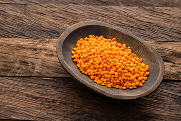 Red lentils in the bowl - Lens culinaris organic.