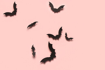 Paper bats for Halloween party on pink background