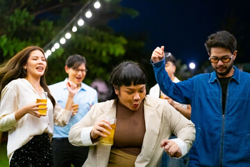 Group of Happy Asian millennial generation people friends enjoy and fun celebration reunion meeting outdoor dinner party with drinking beer and dancing in the garden at restaurant on holiday vacation.