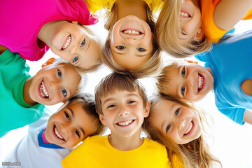 Fototapeta premium Childrens smiling in a huddle looking down in camera